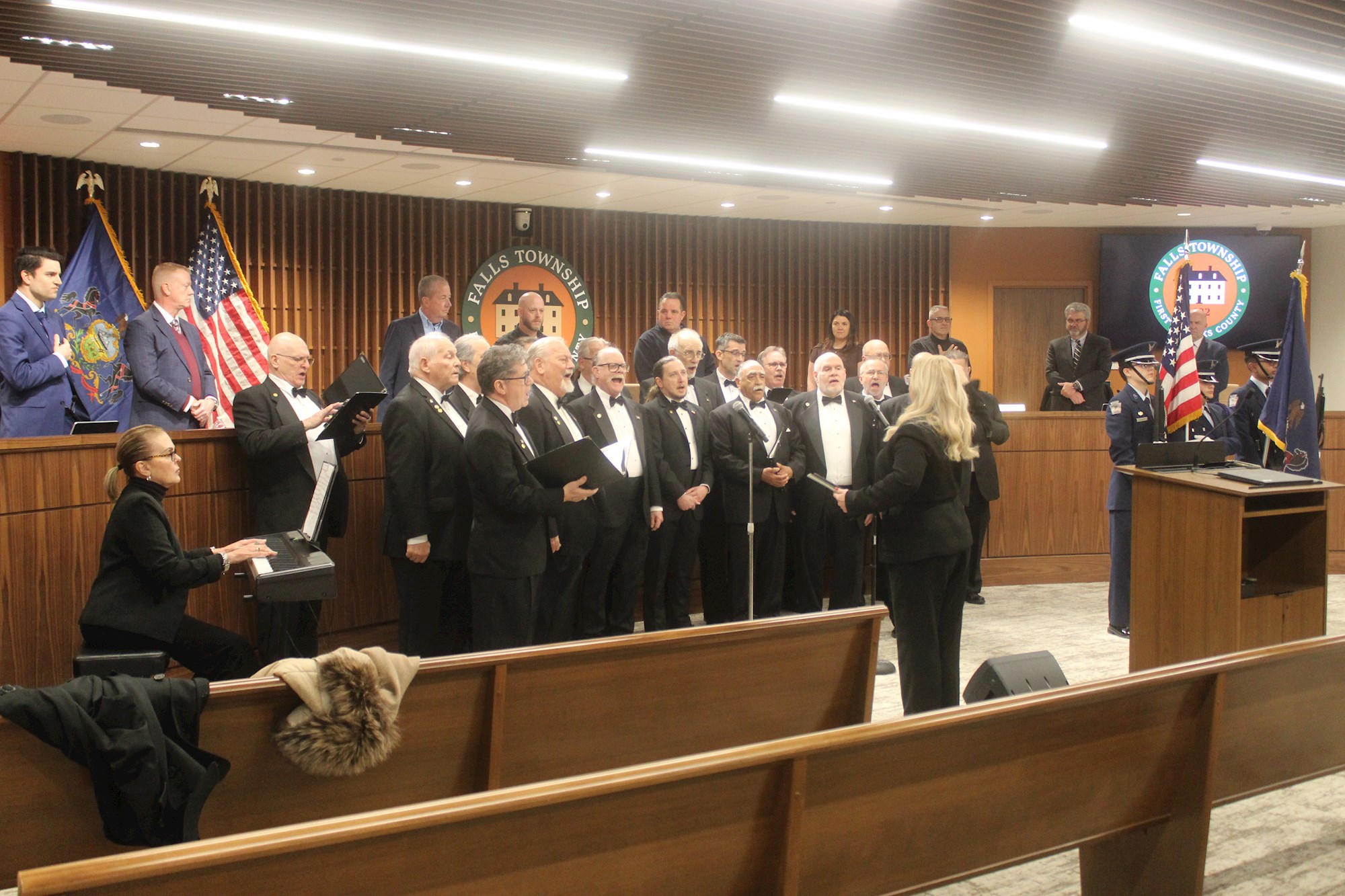 First Falls Supervisors Meeting in New Building Opens with Song, Color Guard